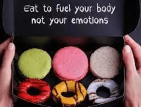 A box of donuts with the words eat to fuel your body not your emotions